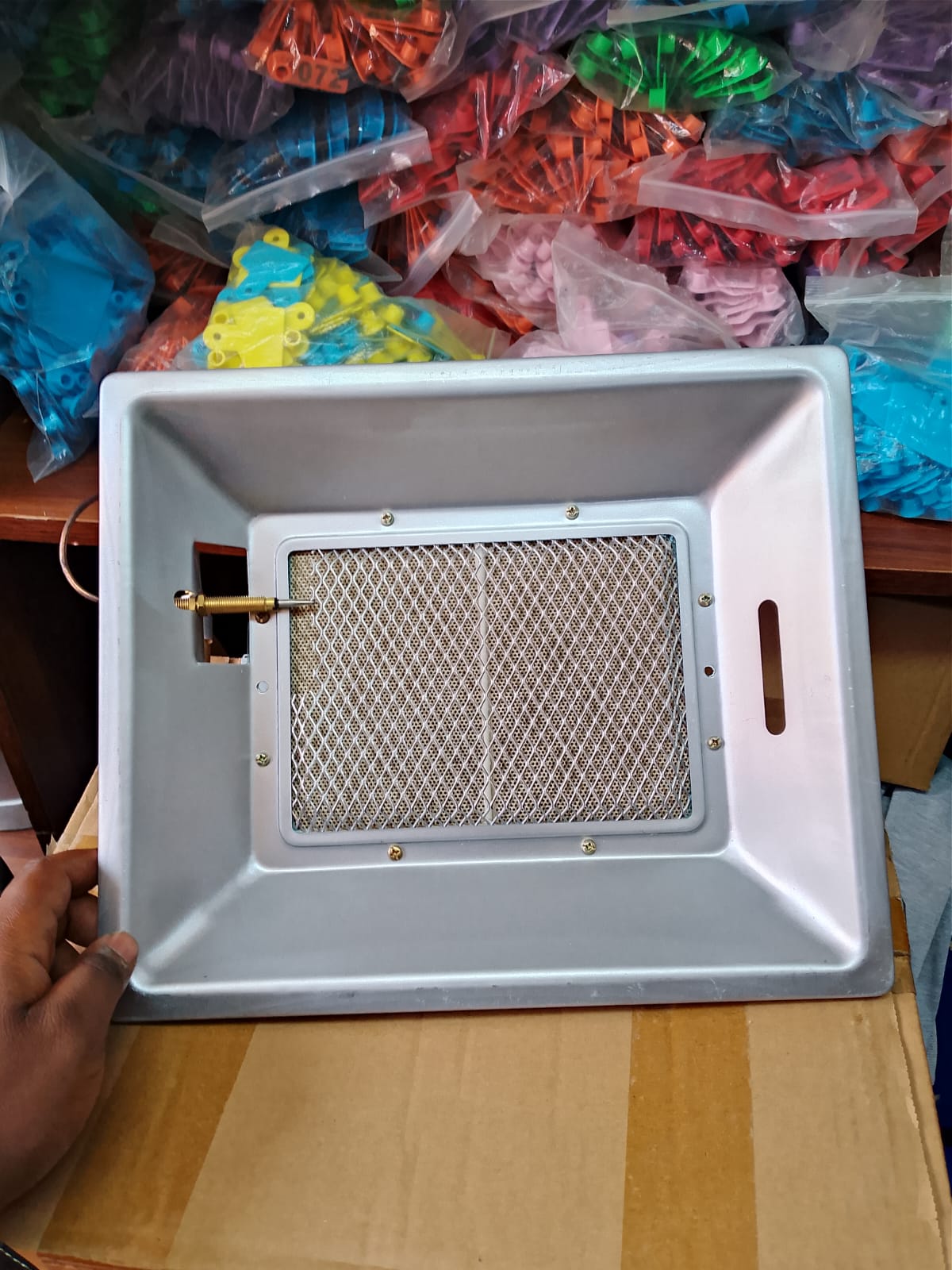 Large commercial gas poultry brooder unit hanging in a broiler house for 1000 chicks